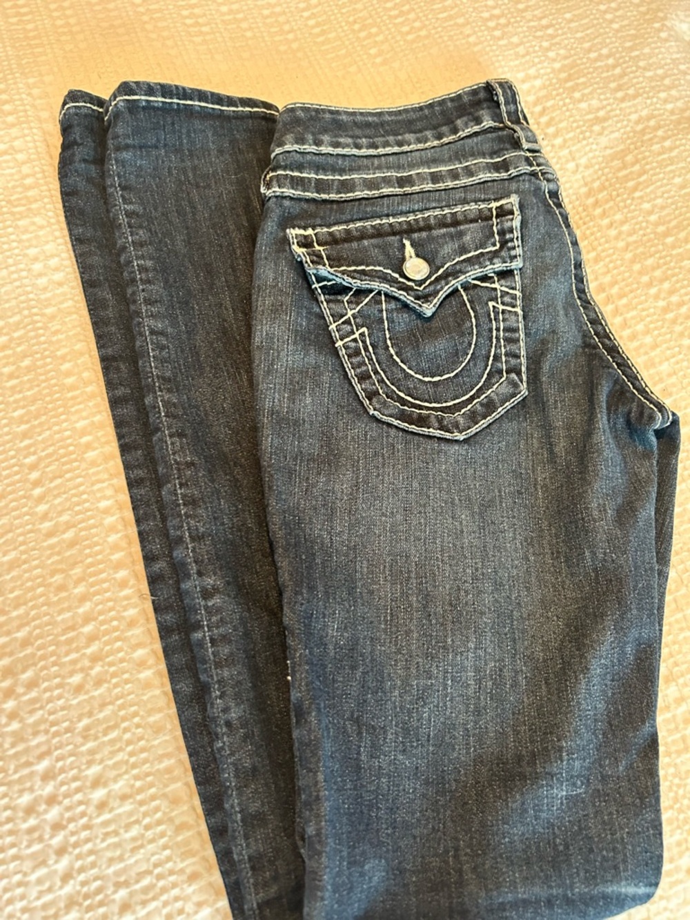 True Religion Women's Dark Blue Skinny Jeans with Rhinestone Accents.